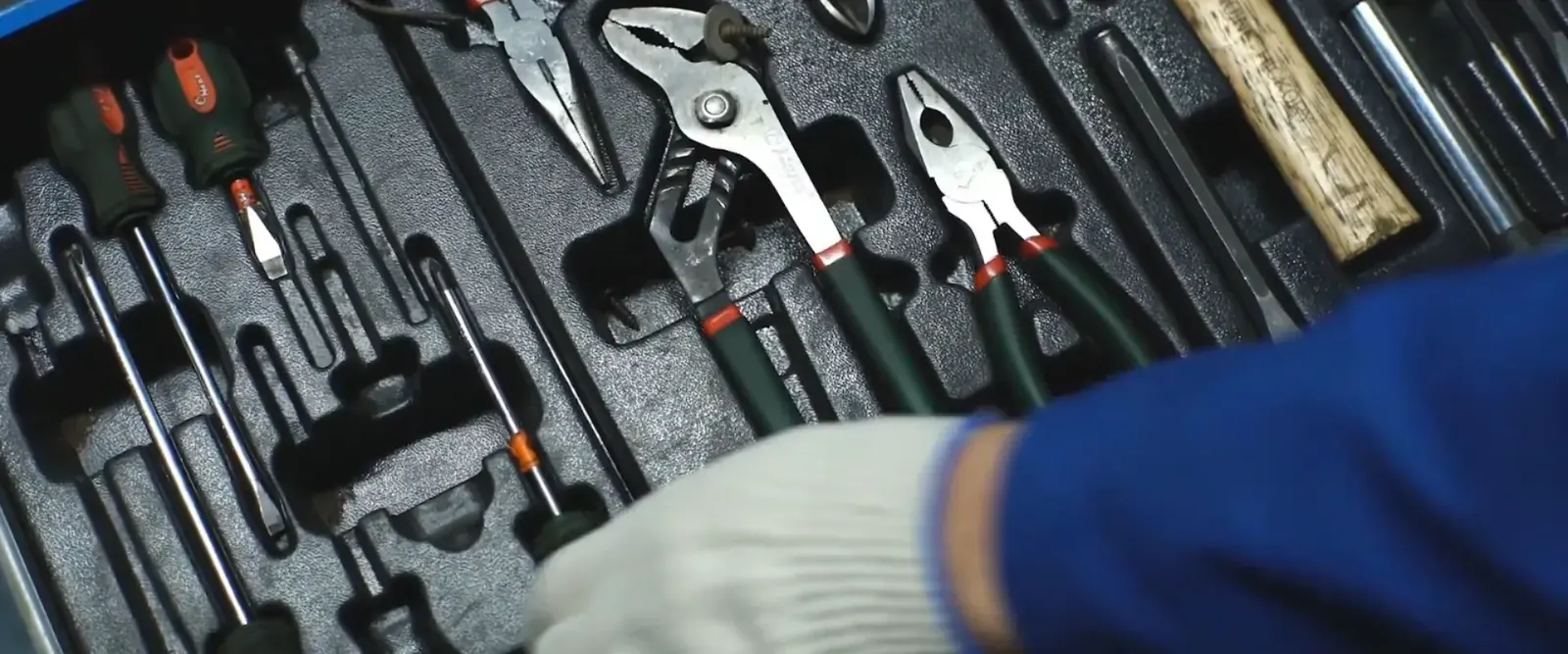 Plumbing hand tools laid out in a case